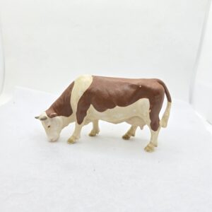 Vache Simmental broutant 13133 - Schleich
